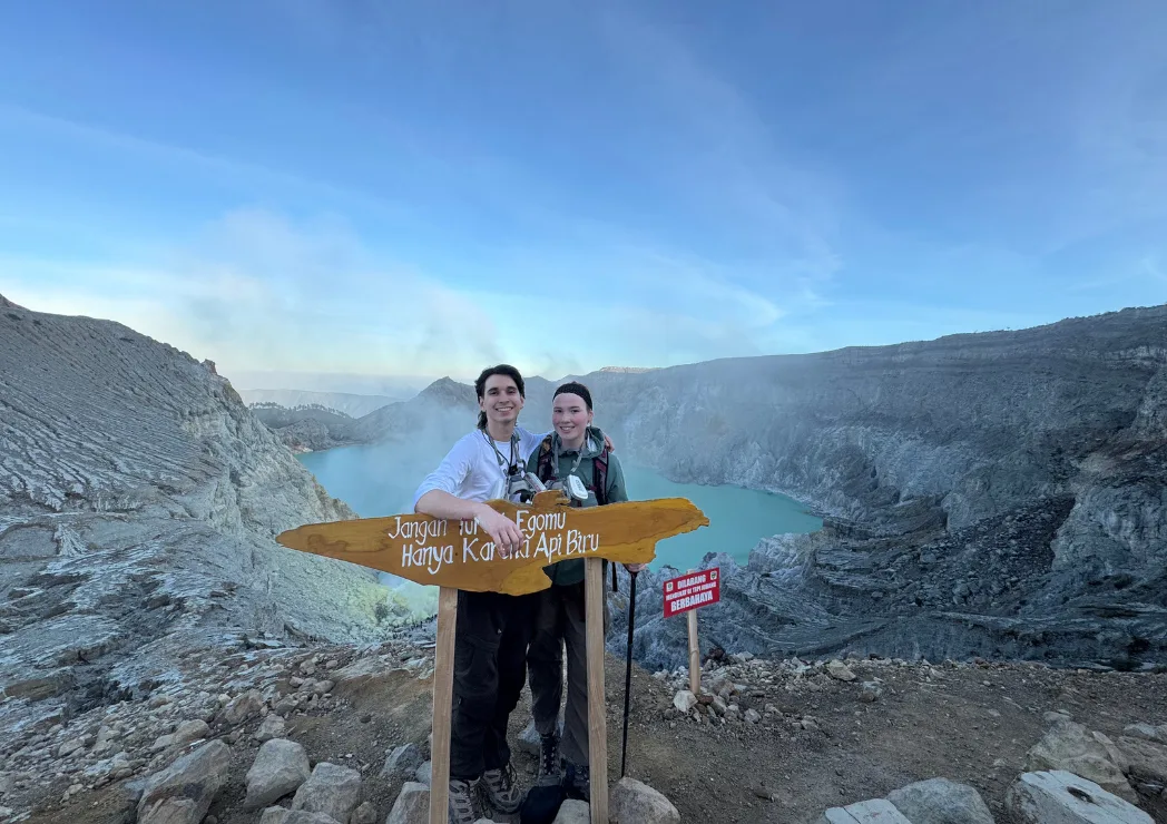 Tourists taking a picture on Mount Ijen crater