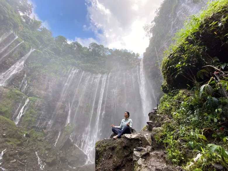 A Traveler in Tumpak Sewu Waterfall