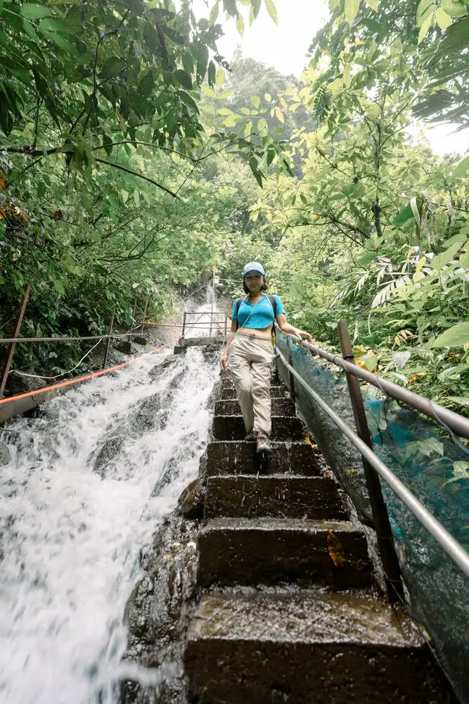 Walking Down the Stairs to Tumpak Sewu Waterfall