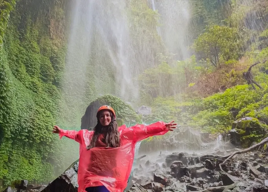 Tourist Enjoying Madakaripura Waterfall In East Java Tourist Enjoying Madakaripura Waterfall In East Java