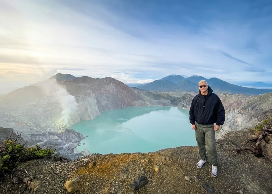 Tourist Taking A Photo Near The Crater Lake Of Mount Ijen Tourist Taking A Photo Near The Crater Lake Of Mount Ijen