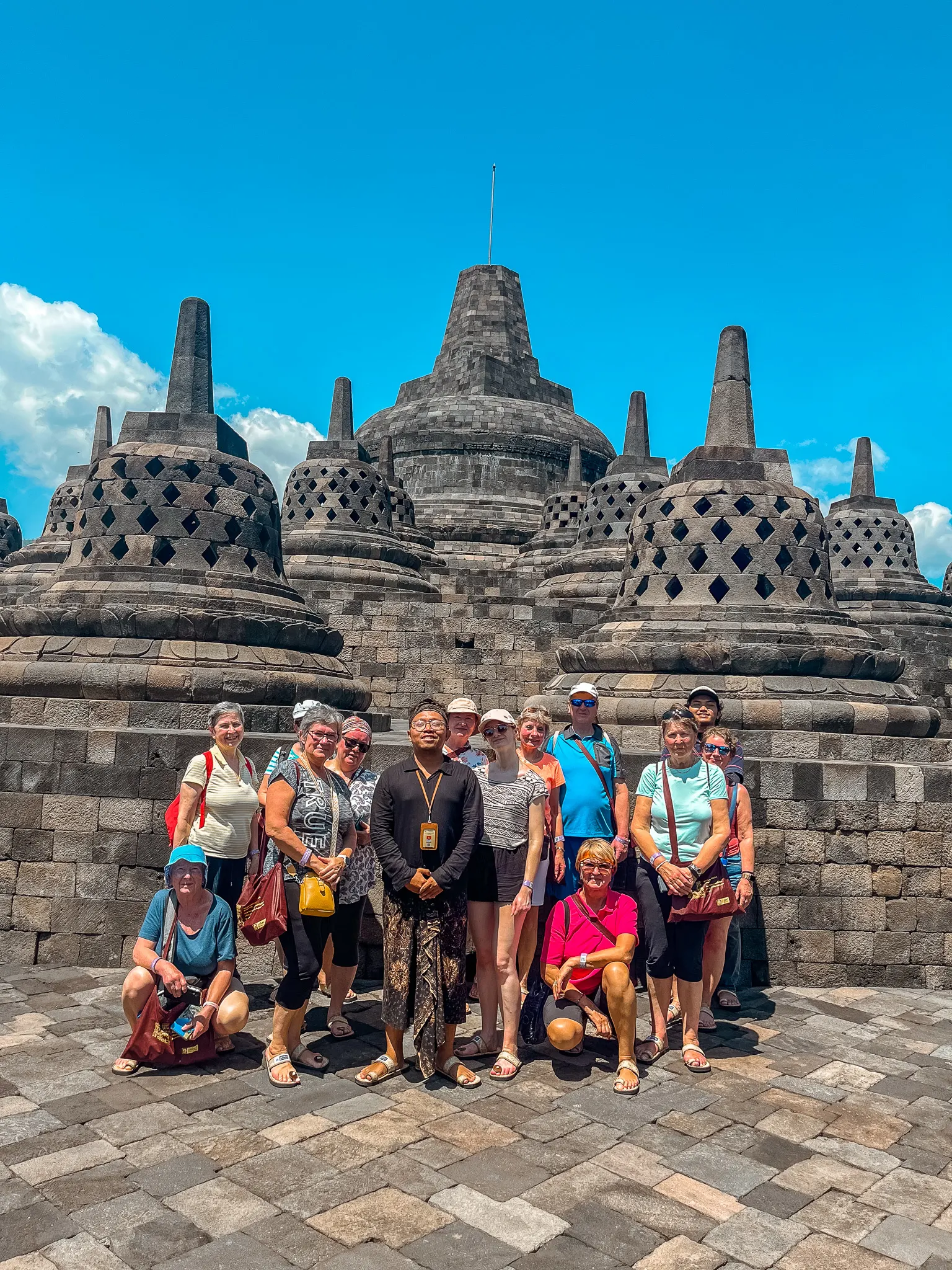 Tourists And Tour Guide Taking A Picture In Borobudur Temple Tourists And Tour Guide Taking A Picture In Borobudur Temple